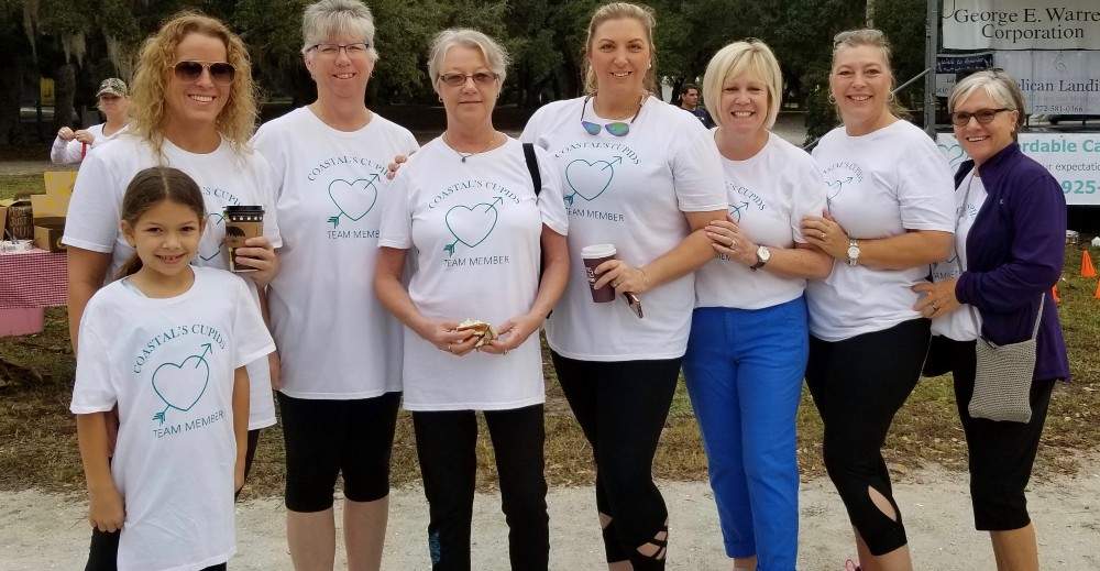 Team members in white t-shirts